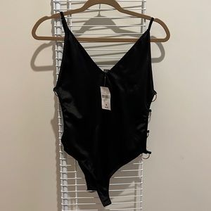 Forever 21 sexy body suit with gold rings down the side